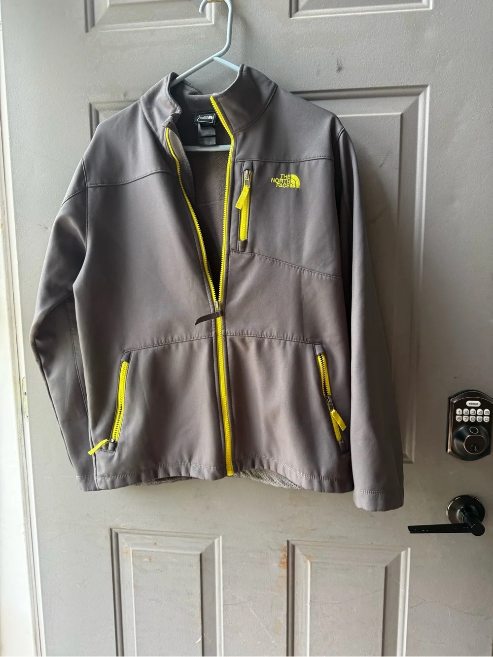 The North Face Gray Softshell Jacket with Yellow Zippers